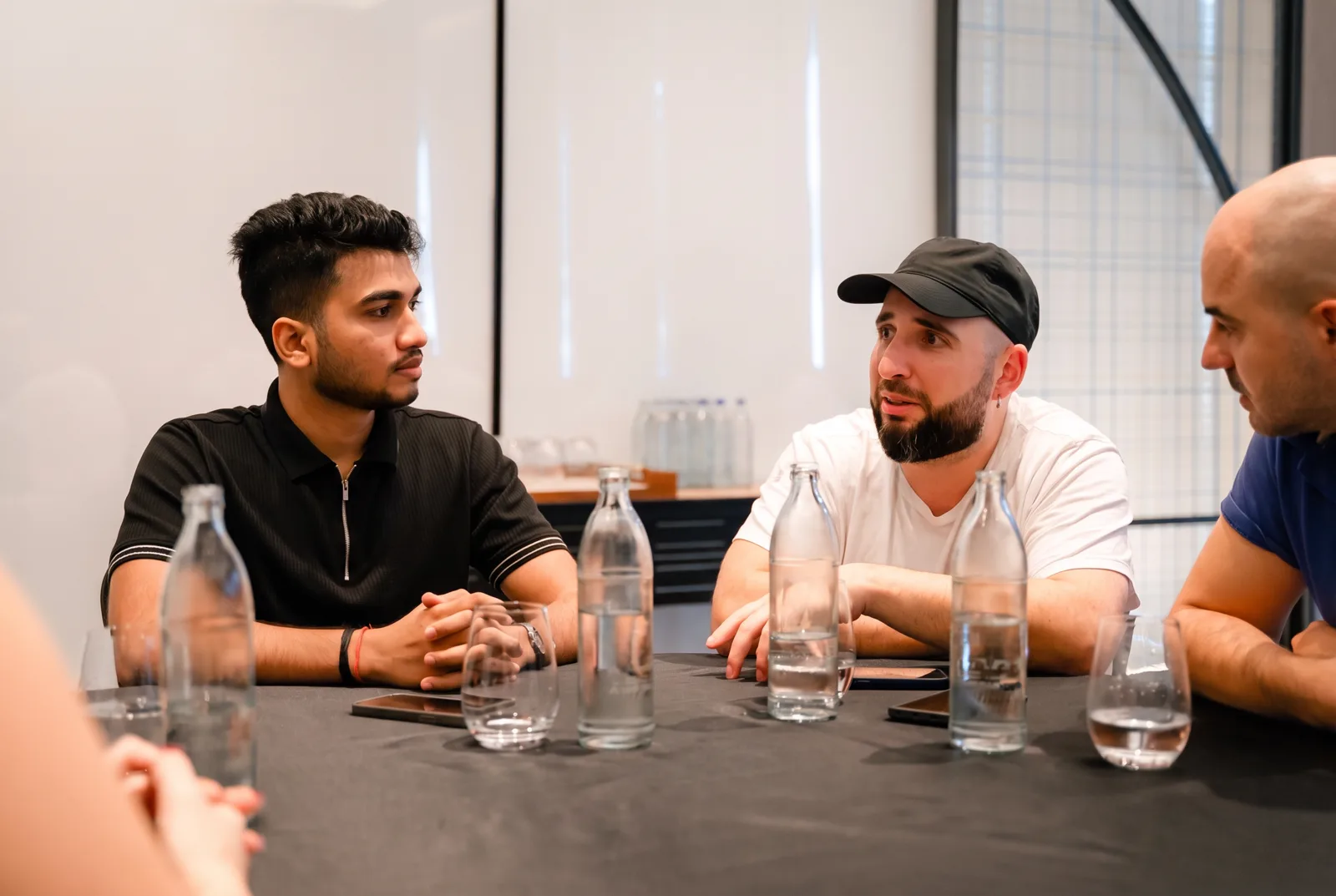 Teammates talking around a table